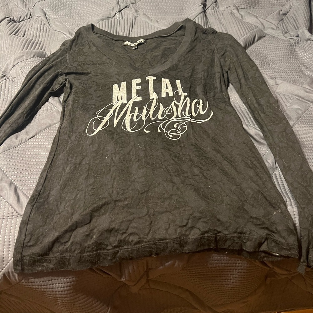 The brand is metal militia size large a little bit see-through color black